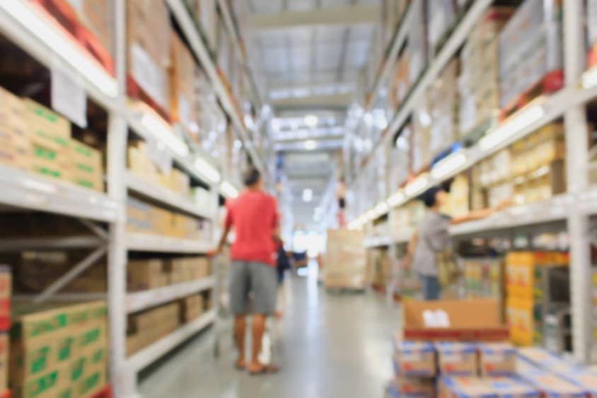 Man Walking Down Shopping Aisle